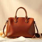 is coach a designer bag